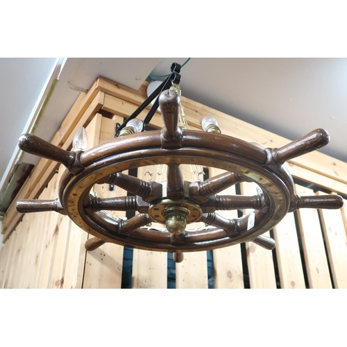 39 - A 20th century oak eight spoke ships wheel with brass boss converted to a chandelier, 80cm diameter&... 