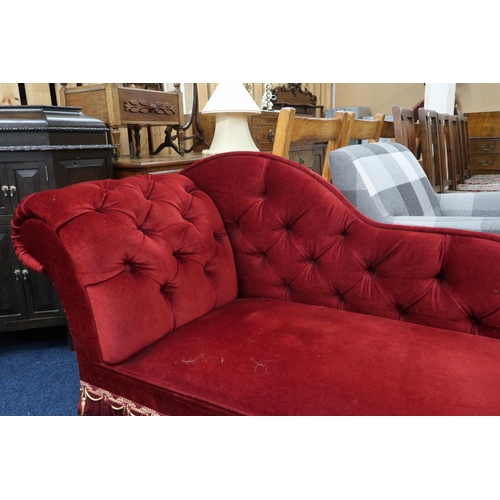 42 - A 20th century red velour button back upholstered chaise longue, 79cm high x 147cm long x 55cm deep ... 