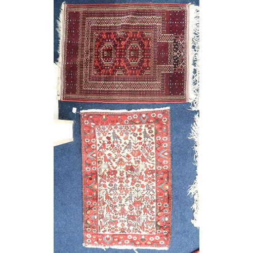 65 - A lot comprising a red ground Bokhara style prayer mat with geometric border, 114cm long x 87cm wide... 