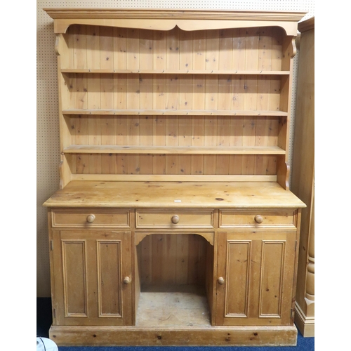 68 - A 20th century pine kitchen dresser with moulded cornice over three open shelves on base with three ... 