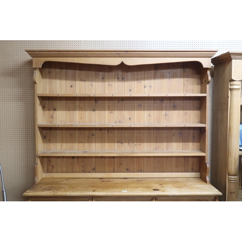 68 - A 20th century pine kitchen dresser with moulded cornice over three open shelves on base with three ... 