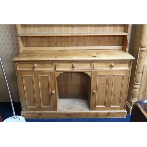 68 - A 20th century pine kitchen dresser with moulded cornice over three open shelves on base with three ... 