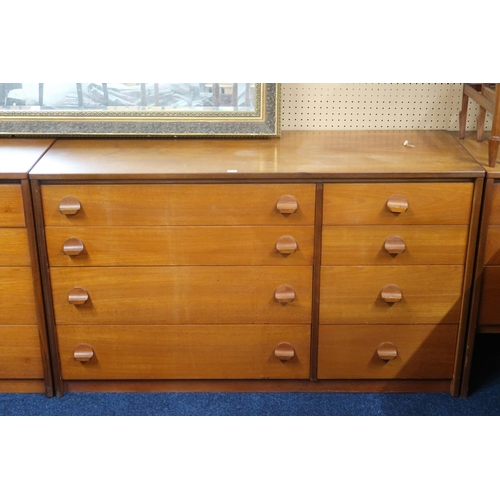 75 - A lot of two mid 20th century teak banks of drawers each with four long alongside four short drawers... 