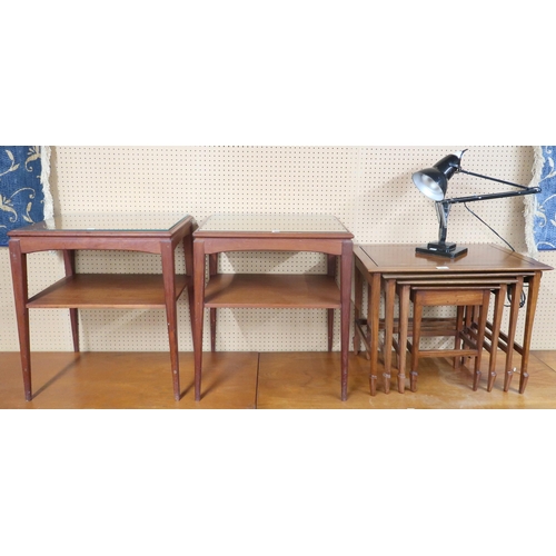 76 - A lot comprising a pair of mid 20th century teak two tier side tables, nest of three tables and a st... 