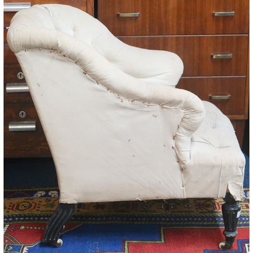 82 - A 19th century button back upholstered armchair in the manner of Howard and Sons with shaped back an... 