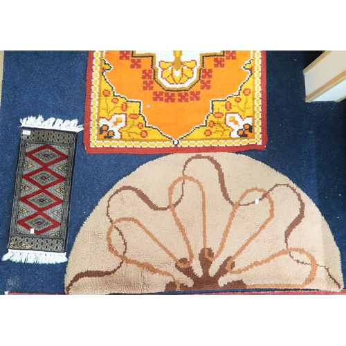 83 - A lot comprising a mid 20th century orange ground rug, 151cm high x 95cm wide, a beige ground half c... 