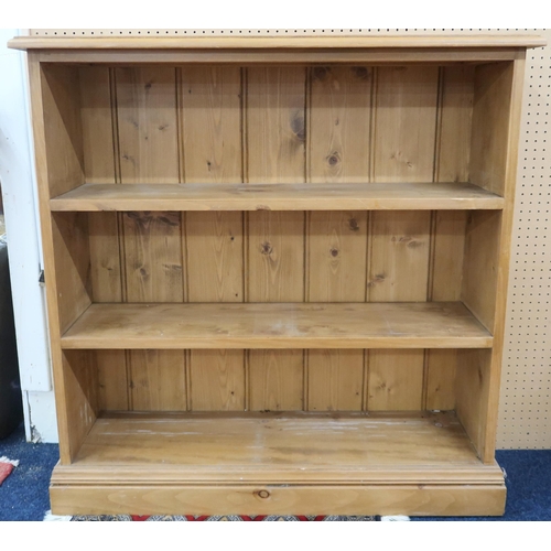 84 - A 20th century pine open bookcase with three shelves on plinth base, 91cm high x 91cm wide x 29cm de... 