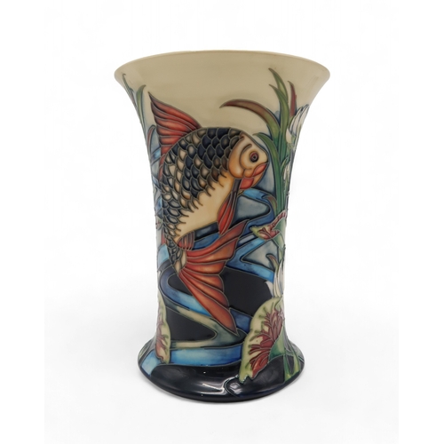 205 - A Moorcroft Derwent pattern vase, designed by Philip Gibson, with tube lined fish and water lilies, ... 