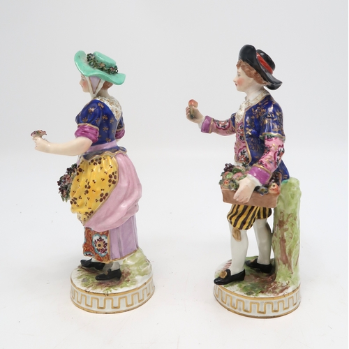 211 - A pair of Derby figures, the man holding a basket of fruit and the lady with flowers in her apron, u... 