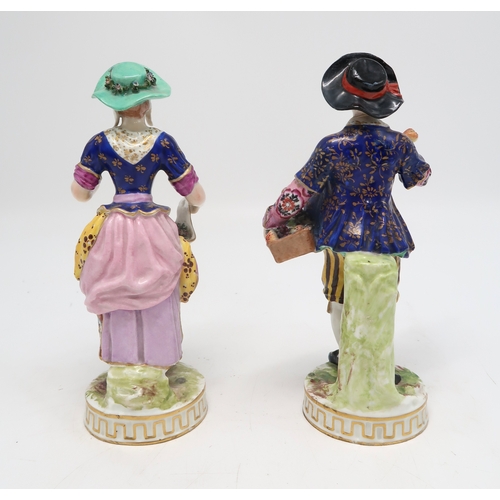 211 - A pair of Derby figures, the man holding a basket of fruit and the lady with flowers in her apron, u... 