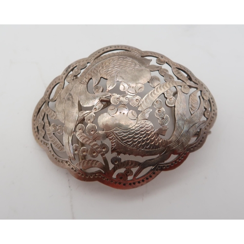 380 - A Chinese white metal belt buckle, decorated with two fish, an a Thai white metal salt (2)