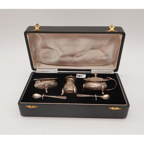 381 - A cased silver manicure set, by Henry Matthews, Birmingham 1909, a silver topped glass pot and nail ... 