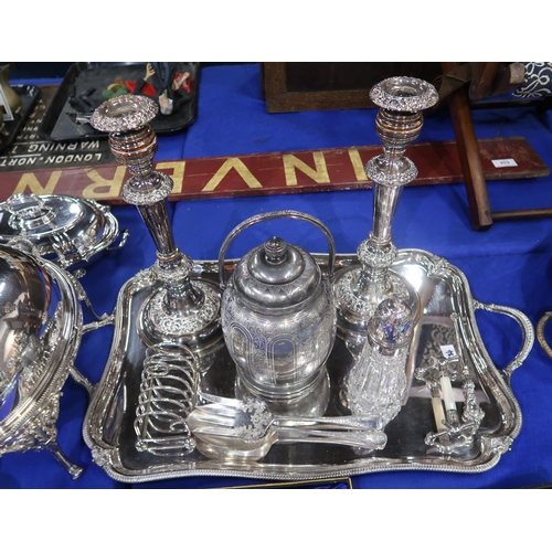 384 - A twin handled tea tray, a pair of candlesticks, serving sets, spoons, a marble stand etc