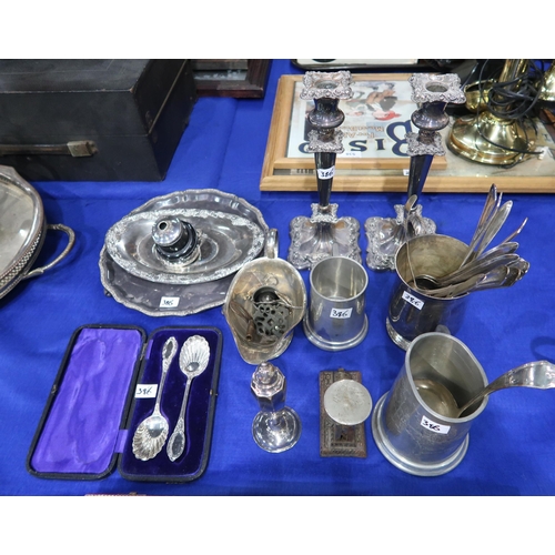 386 - A collection of EPNS including  candlesticks, tankards, horn handled carving sets, salvers, spo... 