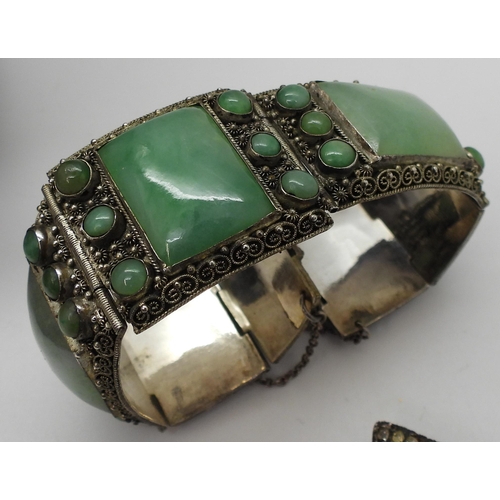 898 - A silver mounted Chinese green hardstone bracelet, a Danish silver brooch by Just A, three brooches ... 