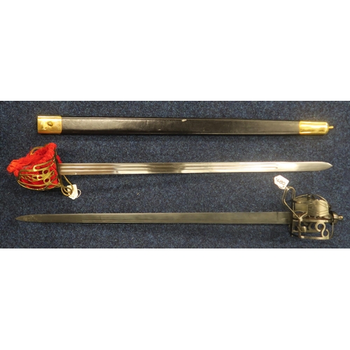 480 - Two Scottish basket-hilted backswords, both of recent manufacture; one with brass basket lined in re... 