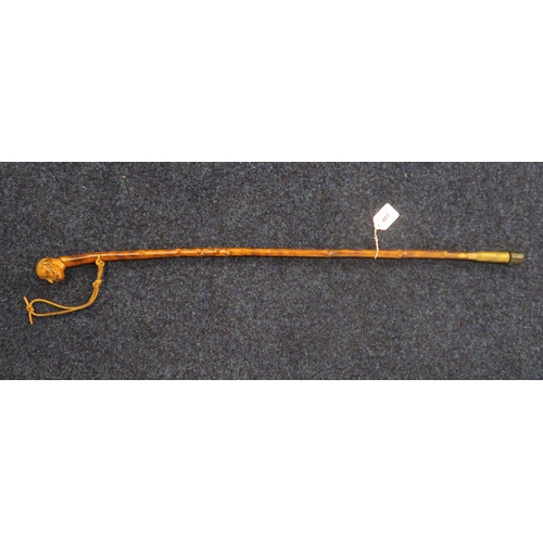 483 - A Trench Art walking stick, the pommel well carved as the head of a gentleman with handlebar moustac... 