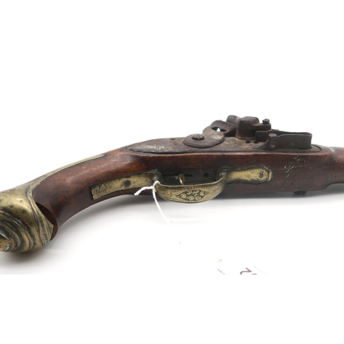 492 - A flintlock pistol, possibly Turkish, the cylindrical barrel measuring approx. 29cm in length, the b... 