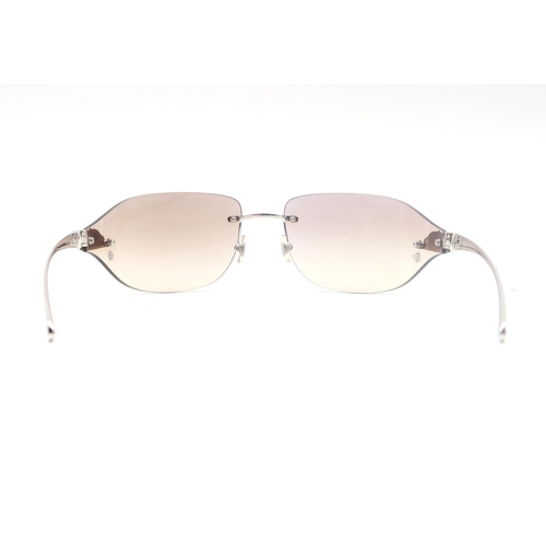 498 - A pair of Cartier sunglasses, with protective case and retaining original packaging 