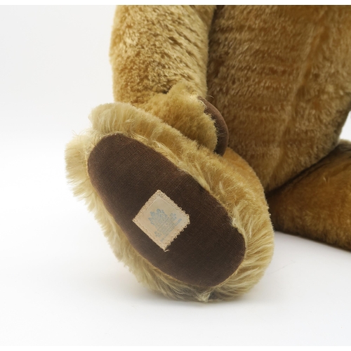 504 - A large Chad Valley teddy bear, with label sewn to velvet paw reading 