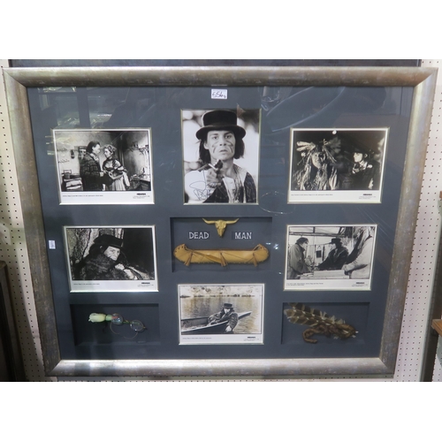 554 - A large framed Pirates of the Caribbean display, featuring photographs autographed by cast members J... 