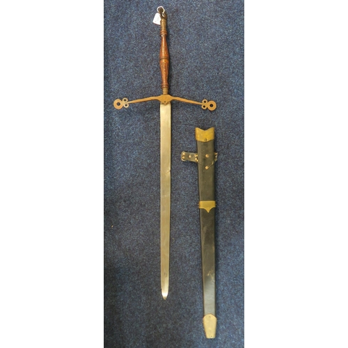 593 - A decorative Scottish Claymore sword with hand-carved grip by P. McNally, dated 1978, the blade meas... 