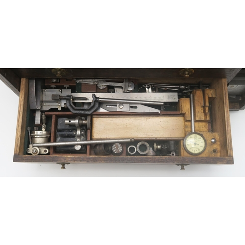 595 - A well-made oak tool chest, containing a large selection of precision engineer's tools, including va... 