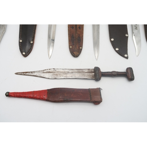 599 - A collection of hunting-style knifes, to include to include two 