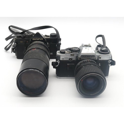 552A - An Olympus OM-2 camera fitted with a Misuki MC Macro 75-260mm 1:4.5 lens and OM10 camera fitted with... 