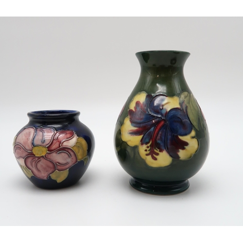 207 - A collection of Moorcroft pottery including two Anemone pattern dishes, a Hibiscus pattern vase and ... 