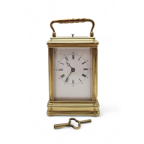 208 - A brass and glass repeating carriage clock