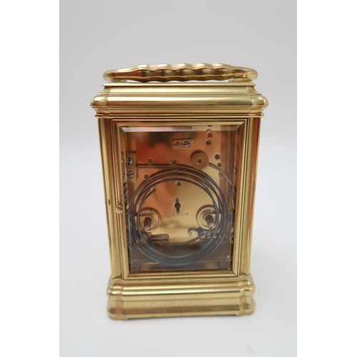 208 - A brass and glass repeating carriage clock