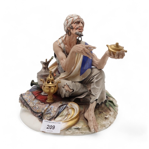 209 - A Capodimonte porcelain figure of a Turkish man, sat on a carpet selling wares