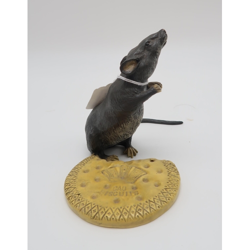 214 - A 20th century after Bergman cold painted bronze figurine of a rat with biscuit, the base stamped 'B... 