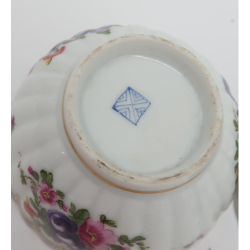 224 - An 18th century Worcester fluted tea bowl, decorated with an internal river landscape, the exterior ... 