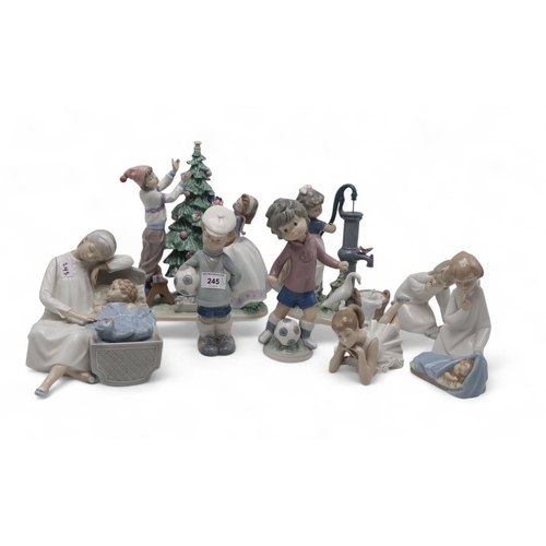 245 - Assorted Lladro and Nao figures including Trimming the Tree, Summer on the Farm etc