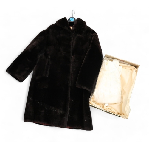 264 - A pair of fox head fur stoles, other fur pieces, a beaver lamb coat and a christening robe