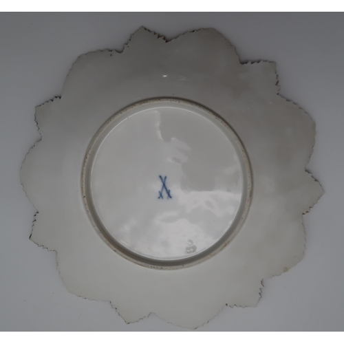 302 - A Meissen plate with moulded vine leaf decoration, in gilt and blue