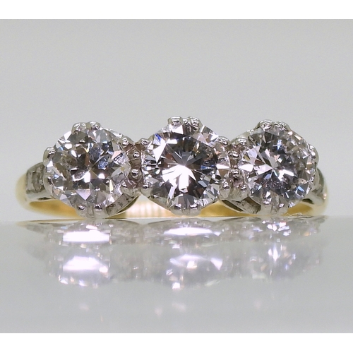 2701 - A THREE STONE DIAMOND RINGset with estimated approx 1.50cts of brilliant cut diamonds, with further ... 