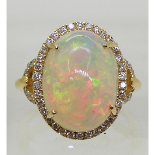 2703 - AN OPAL AND DIAMOND RINGfrom the Illiana premier collection of GemsTV. Set with a substantial caboch... 