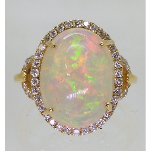 2703 - AN OPAL AND DIAMOND RINGfrom the Illiana premier collection of GemsTV. Set with a substantial caboch... 