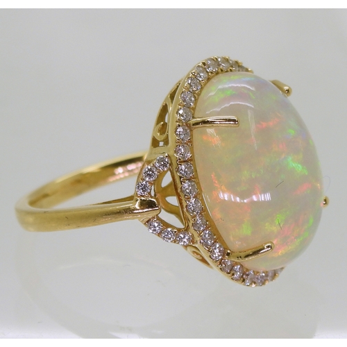 2703 - AN OPAL AND DIAMOND RINGfrom the Illiana premier collection of GemsTV. Set with a substantial caboch... 