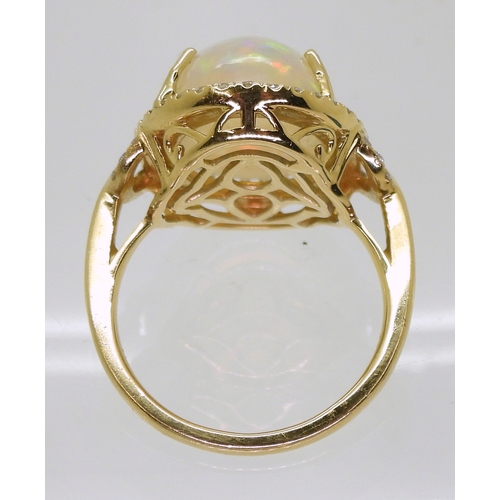 2703 - AN OPAL AND DIAMOND RINGfrom the Illiana premier collection of GemsTV. Set with a substantial caboch... 