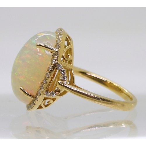 2703 - AN OPAL AND DIAMOND RINGfrom the Illiana premier collection of GemsTV. Set with a substantial caboch... 