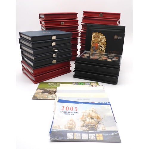 449 - Royal Mint A collection of proof coin sets with De Luxe, Royal Shield Of Arms sets and The Year 2000... 