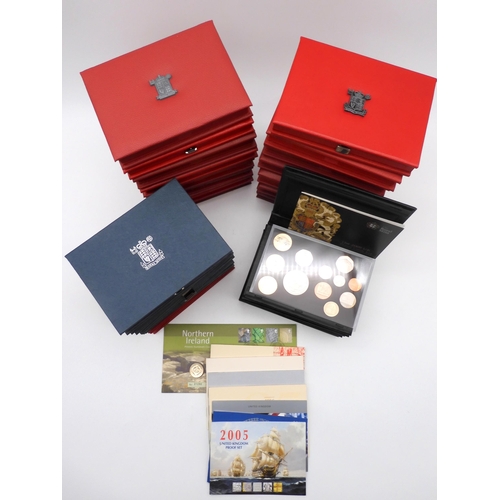 449 - Royal Mint A collection of proof coin sets with De Luxe, Royal Shield Of Arms sets and The Year 2000... 