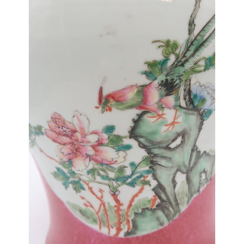 2400 - A CHINESE RUBY GROUND BALUSTER JARPainted with two panels with birds, fruit and foliage, red four ch... 