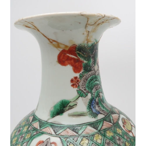 2401 - A CHINESE FAMILLE VERTE BALUSTER VASE Painted with figures in gardens, 44cm high... 