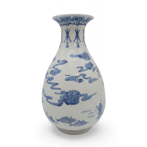 2402 - AN ASIAN BLUE AND WHITE BALUSTER VASE Painted with a dragon, fish, clouds and waves, blue six charac... 