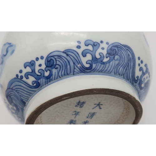 2402 - AN ASIAN BLUE AND WHITE BALUSTER VASE Painted with a dragon, fish, clouds and waves, blue six charac... 